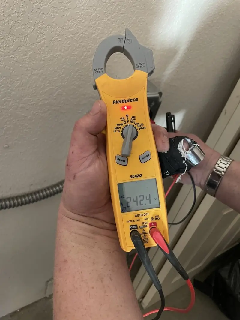 Voltage testing with clamp meter during Whole House Surge Protector in West Reading